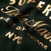Abito in jersey con logo metallico di lusso