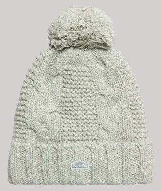 Berretto con pompon a trecce