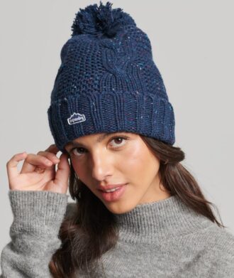 Berretto con pompon a trecce