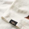 Gilet con strass a tema tatuaggi