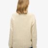 Maglione oversize con collo a V e lavorazione a trecce