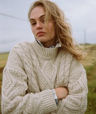 Maglione polo con lavorazione a trecce Aran