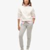 Pantaloni jogger slim con logo metallico di lusso