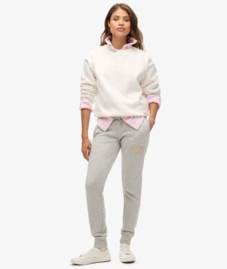 Pantaloni jogger slim con logo metallico di lusso