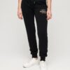 Pantaloni jogger slim con logo metallico di lusso