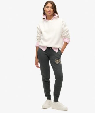 Pantaloni jogger slim con logo metallico di lusso