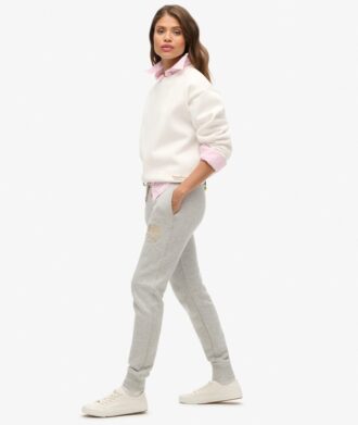 Pantaloni jogger slim con logo metallico di lusso