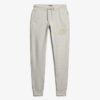 Pantaloni jogger slim con logo metallico di lusso