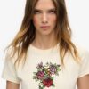 T-shirt aderente con piccolo tatuaggio in strass