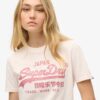 T-shirt comoda con logo metallico