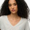 T-shirt con scollo a V ricamata