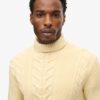 The Merchant Store – Maglione a collo alto con trecce