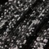 Top con scollo a cappuccio e paillettes