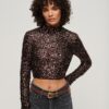 Top corto a maniche lunghe con paillettes