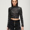 Top corto a maniche lunghe con paillettes