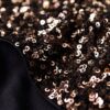 Top corto a maniche lunghe con paillettes