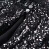 Top corto a maniche lunghe con paillettes