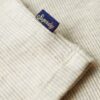 Top essenziale a maniche lunghe in maglia a coste