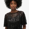 Top trasparente a maniche corte con paillettes