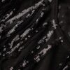 Top trasparente a maniche corte con paillettes